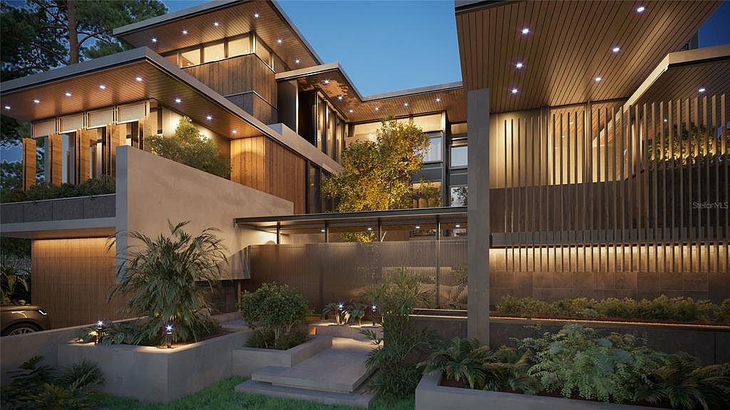 This image showcases the front exterior of a modern, multi-level home with a unique architectural design. The facade features a combination of wood paneling, concrete, and glass, creating a sophisticated and contemporary aesthetic. Lush landscaping surrounds the property, enhancing its curb appeal and creating a welcoming atmosphere. The perspective is from a slightly low angle, emphasizing the height and scale of the building.