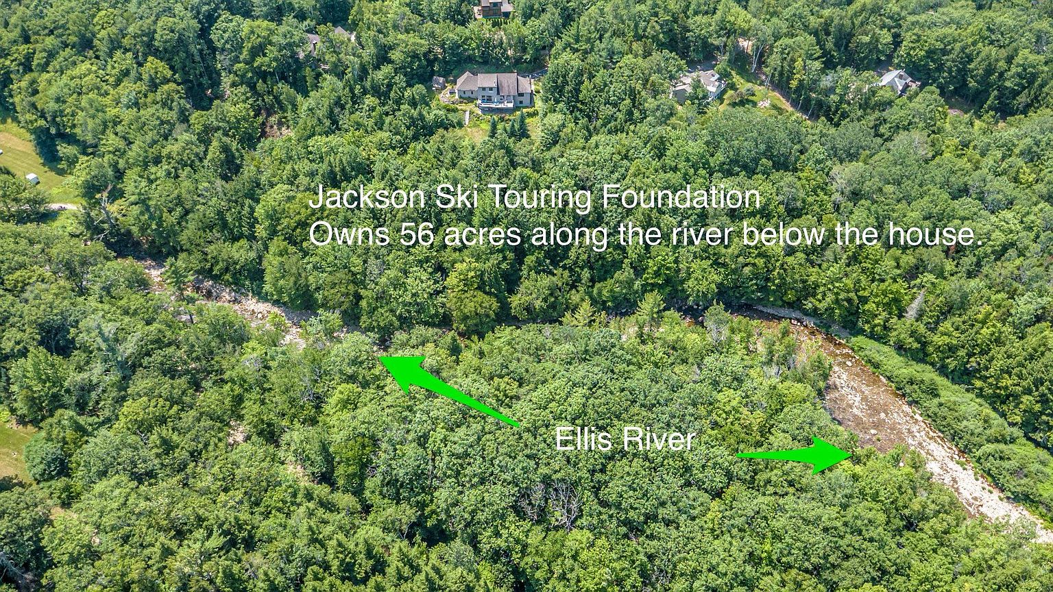 This aerial perspective captures a lush, wooded landscape featuring a winding river, identified as the Ellis River, flowing through the dense forest. A large residential property is visible in the upper portion of the frame, surrounded by mature trees and greenery. Text overlays provide context regarding the surrounding land ownership, highlighting the natural setting and proximity to the river.