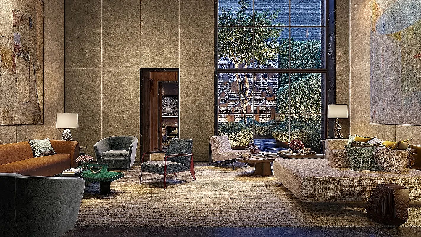 This sophisticated, expansive living room features a warm, neutral color palette with a mix of plush seating, including a large sectional and several accent chairs. A massive window wall provides a clear view of a landscaped courtyard with trees, while large abstract art pieces adorn the textured walls. The space is anchored by a textured area rug and low-profile coffee tables, creating a luxurious and inviting atmosphere.