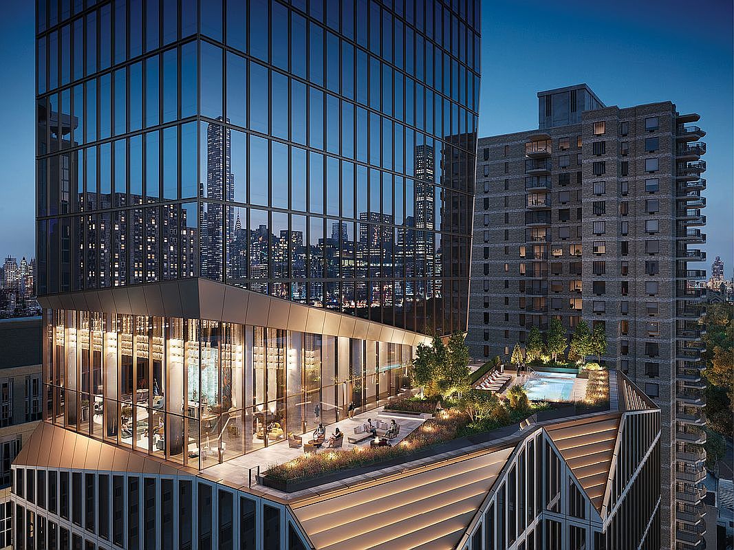 This high-angle aerial shot captures a luxurious rooftop terrace of a modern skyscraper at twilight, featuring a sleek glass-walled lounge and an inviting outdoor pool area. The terrace is landscaped with lush greenery and ambient lighting, creating a sophisticated urban oasis against the backdrop of a sprawling city skyline. The architectural design emphasizes contemporary elegance, blending sharp geometric lines with warm, inviting communal spaces.