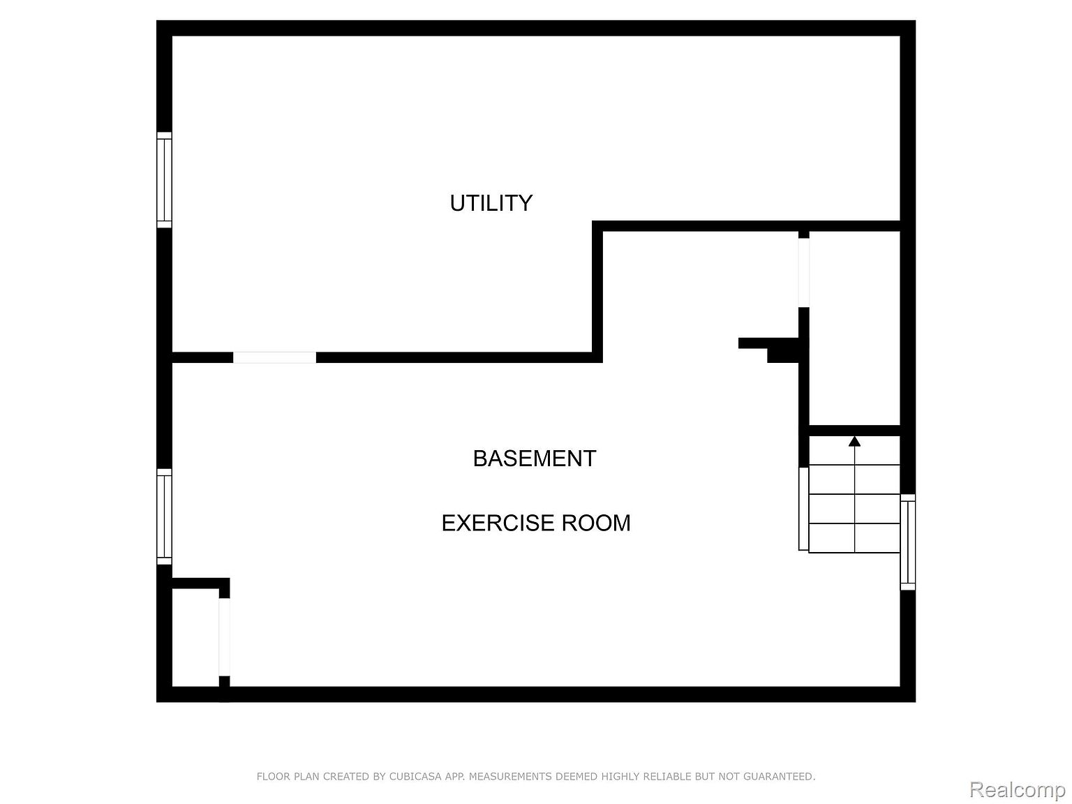 This is a floor plan of a basement, featuring a utility area, a basement area, and an exercise room. The layout shows the spatial relationships between these areas, including the staircase leading down to the basement. The floor plan is simple and functional, providing a clear overview of the basement's layout.