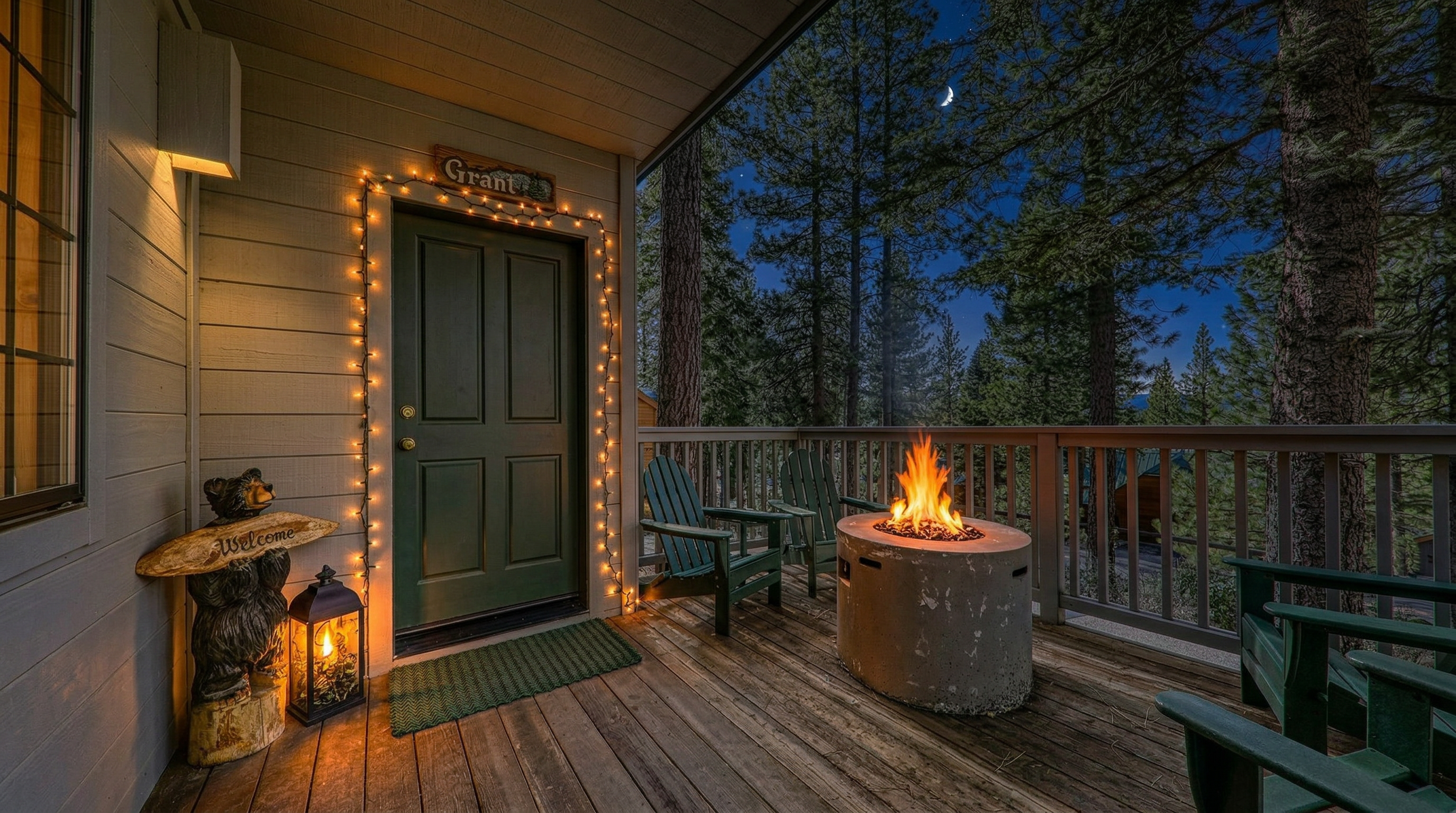 This cozy wooden deck features comfortable green Adirondack chairs surrounding a circular concrete fire pit, perfect for outdoor relaxation. The space includes a welcoming bear-themed statue near the entrance, enhancing the rustic, cabin-style aesthetic. Surrounded by tall pine trees, the deck offers a peaceful, scenic view perfect for enjoying the outdoors.