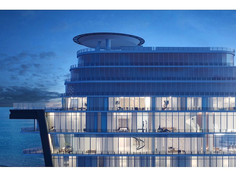 This image showcases a modern high-rise building with a unique architectural design, featuring multiple levels of glass-enclosed residences. The building's side view reveals expansive balconies and a helipad on the roof, emphasizing luxury and exclusivity. The structure is positioned near the water, suggesting waterfront property with stunning views.