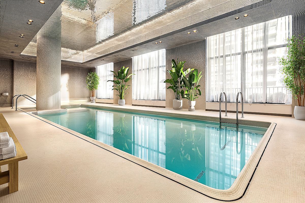 This luxurious indoor swimming pool area features a sleek, modern design with a reflective metallic ceiling and large floor-to-ceiling windows that bathe the space in natural light. The room is accented with potted tropical plants and a minimalist aesthetic, creating a serene and high-end atmosphere. The perspective is captured from a low angle, emphasizing the length of the pool and the sophisticated architectural details of the facility.