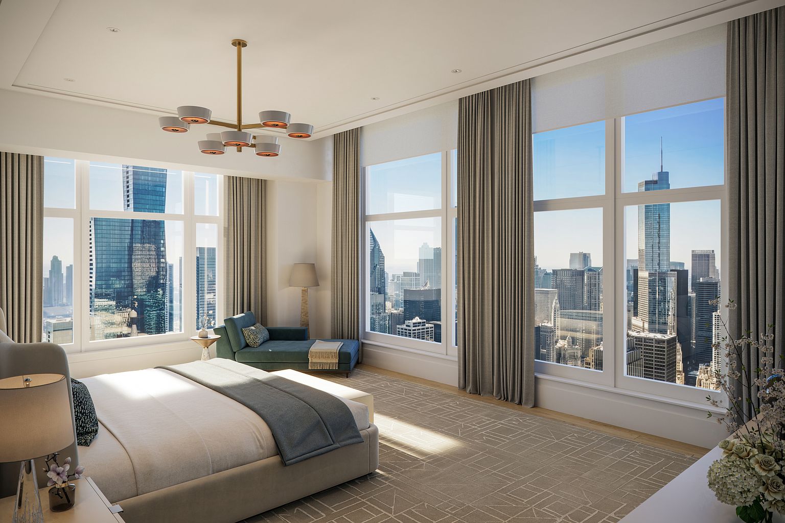 This luxurious primary bedroom features a neutral color palette and expansive floor-to-ceiling windows that offer panoramic city skyline views. The room is furnished with a plush bed, a contemporary teal chaise lounge, and a modern multi-arm chandelier, all set against a patterned area rug. The space exudes a sophisticated, high-rise urban aesthetic with clean lines and abundant natural light.