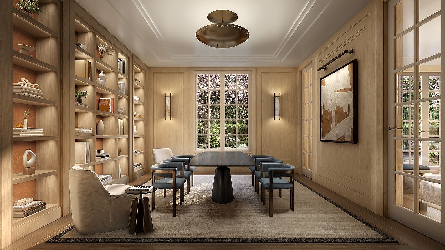 This sophisticated home office or study features extensive built-in light wood shelving that spans the wall, providing ample storage and display space. A central dark table with six matching chairs serves as the focal point, complemented by a plush area rug and a comfortable armchair in the foreground. The room is illuminated by a unique, wide pendant light and wall-mounted sconces, creating a warm, professional atmosphere with views through a window to the greenery outside.