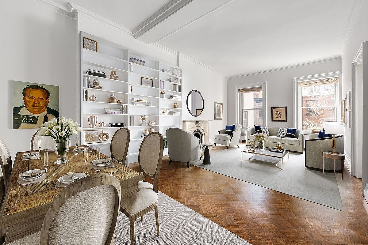 This elegant, open-concept living and dining area features rich, herringbone-patterned wood flooring and bright, neutral walls. The space is anchored by a large, built-in white bookshelf and a classic fireplace with a decorative mantel, while a formal dining set sits in the foreground. Large windows allow natural light to fill the room, creating a sophisticated and airy atmosphere suitable for refined living.