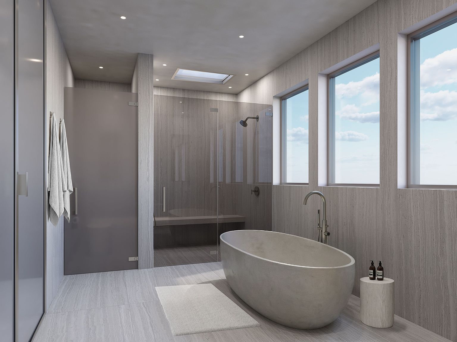 This serene primary bathroom features a minimalist aesthetic with light-toned, textured wall paneling and matching tile flooring. A sculptural, oval-shaped soaking tub serves as the centerpiece, complemented by a glass-enclosed walk-in shower with a built-in bench. Large windows allow natural light to fill the space, creating an airy and tranquil atmosphere.