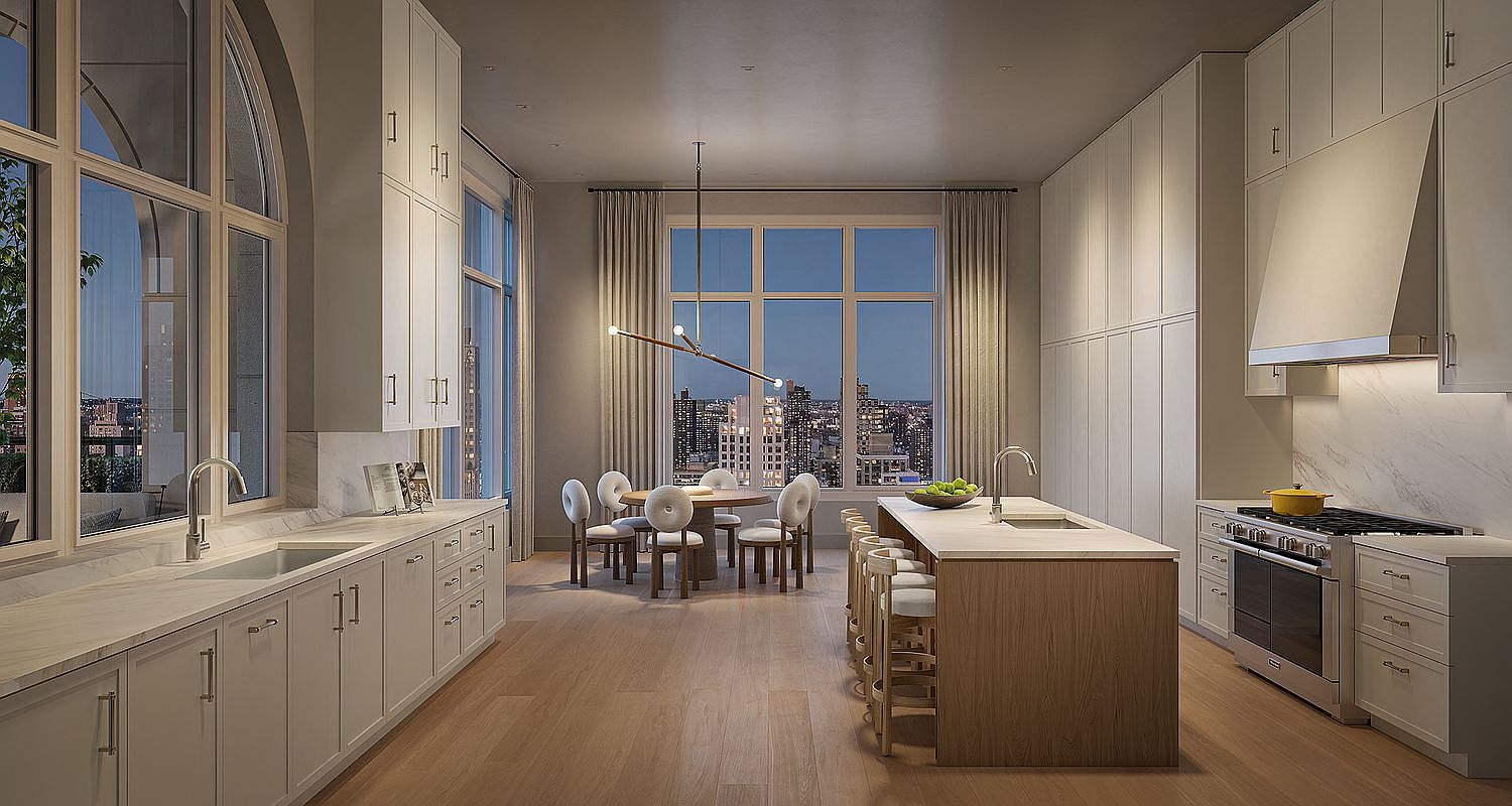 This sophisticated, high-end kitchen features a seamless blend of light wood tones and crisp white cabinetry, anchored by a large central island with a waterfall-edge countertop. The space is bathed in natural light from expansive floor-to-ceiling windows that frame a stunning urban skyline view, complemented by a modern dining area. The overall aesthetic is one of refined luxury, characterized by clean lines, premium stainless steel appliances, and an open-concept layout perfect for entertaining.