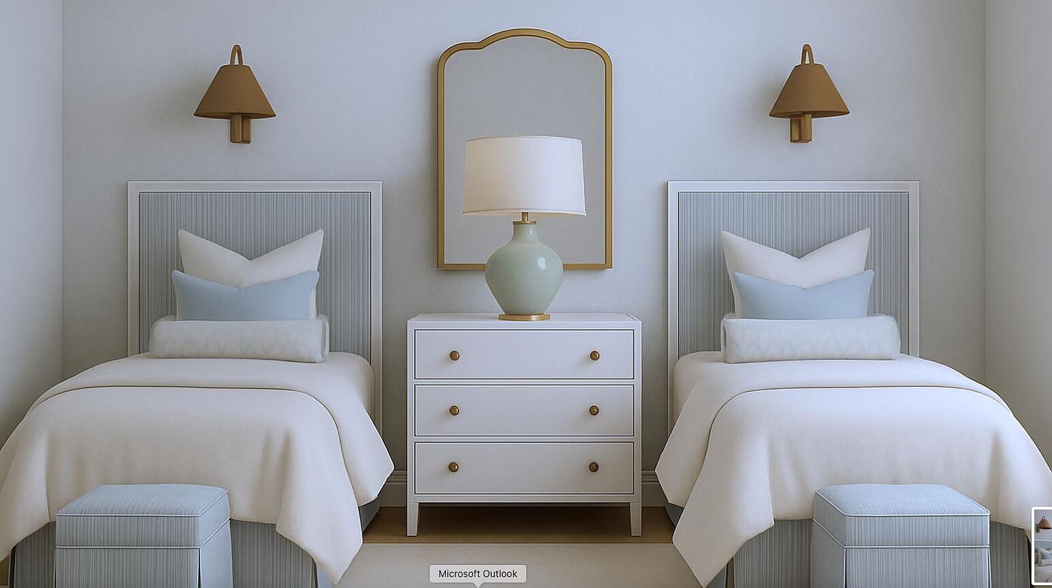 This is a well-staged guest bedroom featuring two twin beds, each with light blue and white bedding and matching ottomans. A white dresser with gold hardware sits between the beds, topped with a lamp and framed by a gold-framed mirror. The room has a calm and inviting atmosphere, perfect for a real estate listing.