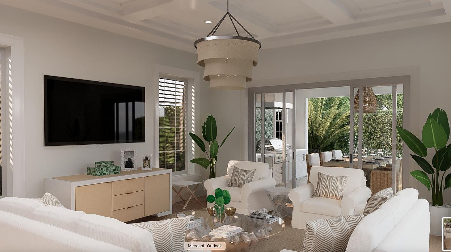 This is a bright and airy living room featuring a large flat-screen TV mounted above a modern sideboard. The room is furnished with comfortable white sofas and armchairs, complemented by a stylish chandelier. Sliding glass doors lead to an outdoor dining area, creating a seamless indoor-outdoor living experience.