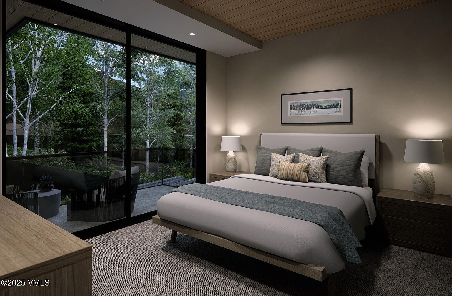 This is a serene primary bedroom featuring a neutral color palette and a minimalist design. A large window offers a view of the surrounding trees, bringing the outdoors in. The room is furnished with a bed, nightstands, and lamps, creating a cozy and inviting atmosphere.