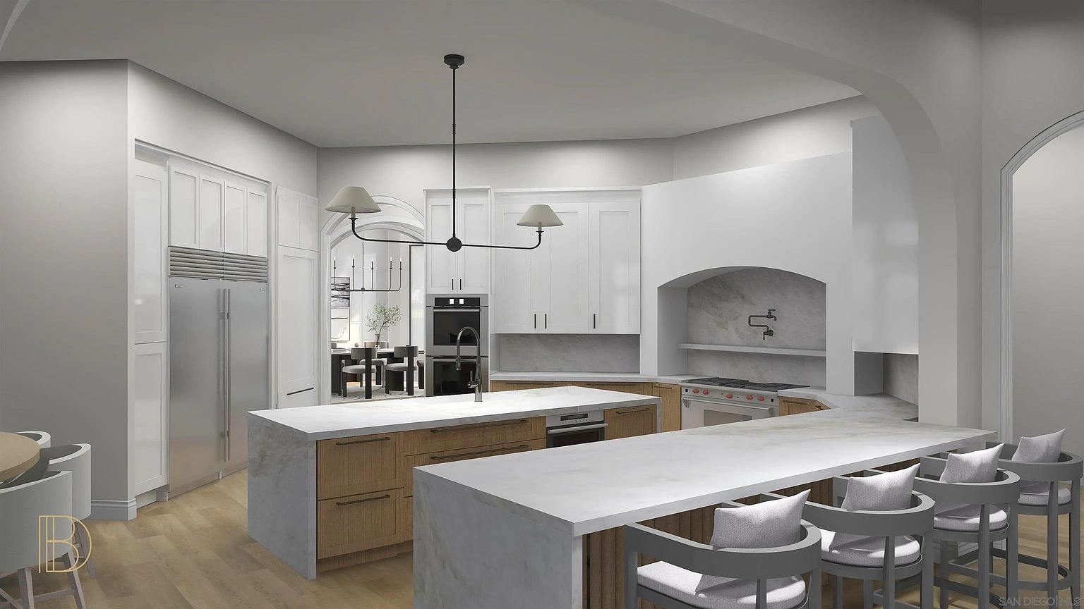 This is a bright and spacious kitchen featuring white cabinetry, stainless steel appliances, and a large island with a white countertop. The kitchen also has a modern lighting fixture and bar stool seating at the island. The overall style is modern and luxurious.