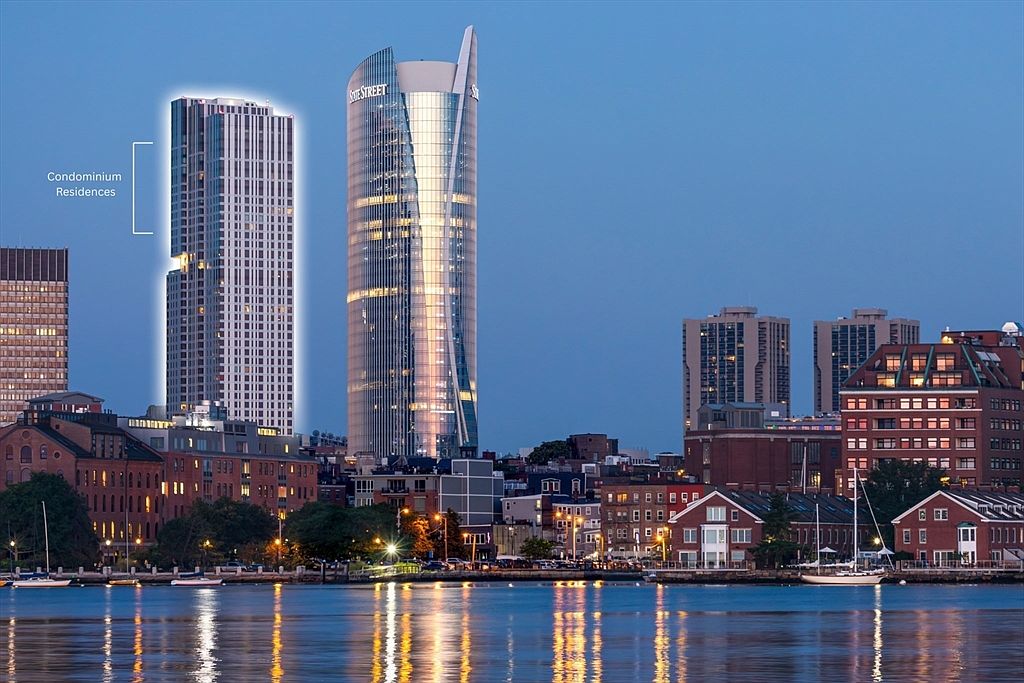 This image showcases a stunning waterfront view of modern condominium residences. The architecture features sleek, high-rise buildings with reflective glass facades, illuminated by evening light. The water reflects the city lights, creating a vibrant and luxurious atmosphere, perfect for highlighting the upscale urban living experience.