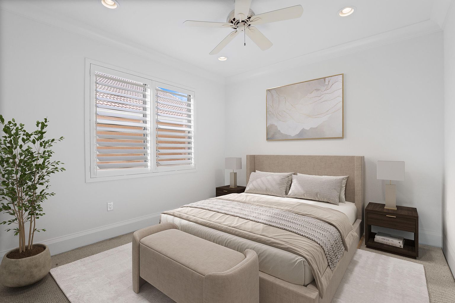 This is a bright and airy primary bedroom featuring a neutral color palette. The room includes a large bed with a padded headboard, two bedside tables with lamps, and a bench at the foot of the bed. A large window with shutters provides natural light, and a piece of artwork hangs above the bed, creating a serene and inviting atmosphere.