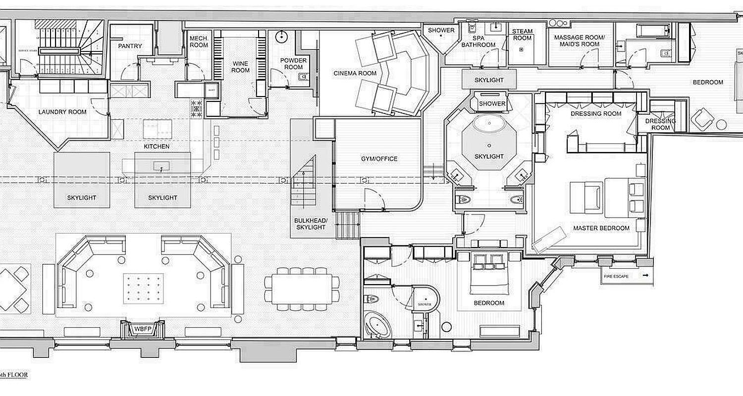 This image is a detailed architectural floor plan for a luxury residential property, showcasing an expansive layout with multiple specialized rooms. The design includes a central kitchen and living area, a dedicated cinema room, a gym/office, and a primary suite complete with a dressing room and spa-style bathroom. The layout also features functional spaces like a laundry room, pantry, and wine room, all organized around a central staircase and various skylights.