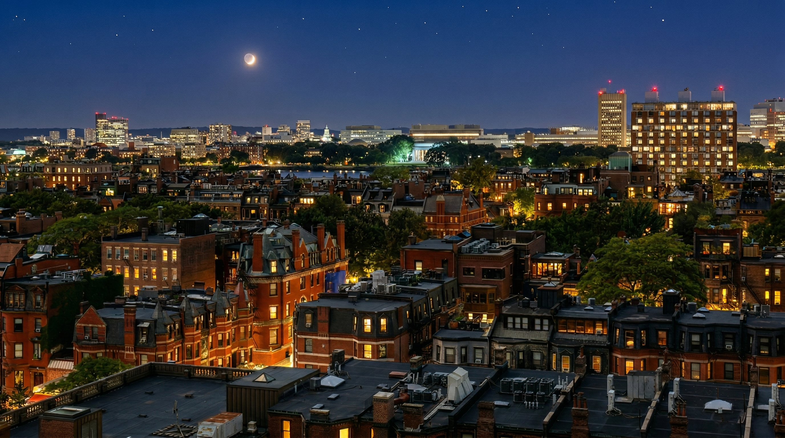 This panoramic aerial view captures the historic charm of a dense urban neighborhood, characterized by iconic brick row houses and classic architectural details at twilight. The scene extends to a vibrant city skyline featuring various commercial and institutional buildings, highlighted by the tranquil glow of city lights and a crescent moon in the night sky. The composition offers an expansive and atmospheric perspective of a prime residential location balanced with urban accessibility.