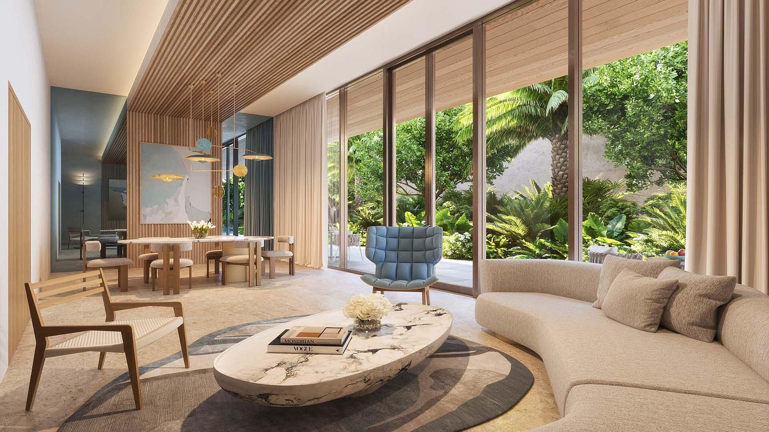 This is a bright and airy living room featuring a curved sofa, a marble coffee table, and a blue accent chair. Large windows offer views of lush greenery, creating a seamless indoor-outdoor living experience. The room is decorated in neutral tones with wood accents, creating a modern and inviting atmosphere.