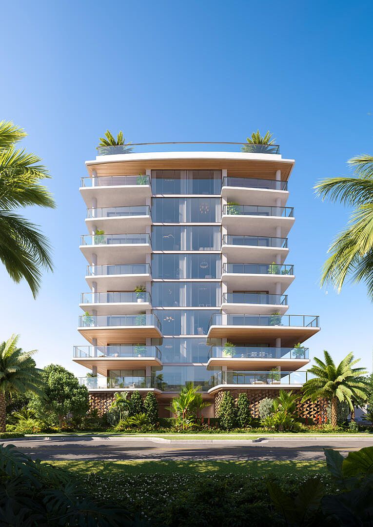 This image showcases the front exterior of a modern, multi-story condominium building. The building features expansive glass windows and private balconies with glass railings, offering stunning views. Lush landscaping surrounds the base of the building, creating a tropical and inviting atmosphere.