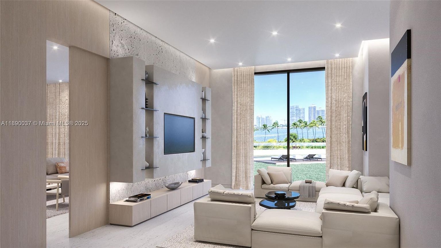 This is a modern living room featuring a large sectional sofa, a flat-screen TV mounted on a textured wall, and floor-to-ceiling windows offering a view of a waterfront cityscape. The room is decorated in neutral tones, creating a bright and airy atmosphere. The design emphasizes clean lines and minimalist decor, contributing to a luxurious and contemporary feel.