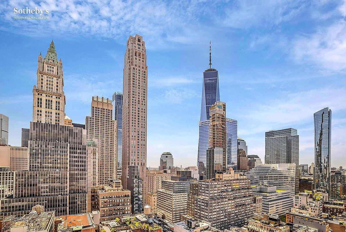 This aerial view showcases a stunning cityscape with prominent skyscrapers and architectural landmarks under a bright blue sky. The composition emphasizes the density and grandeur of the urban environment, highlighting the modern design and scale of the buildings. The image conveys a sense of prestige and sophistication, ideal for showcasing luxury real estate in a prime location.