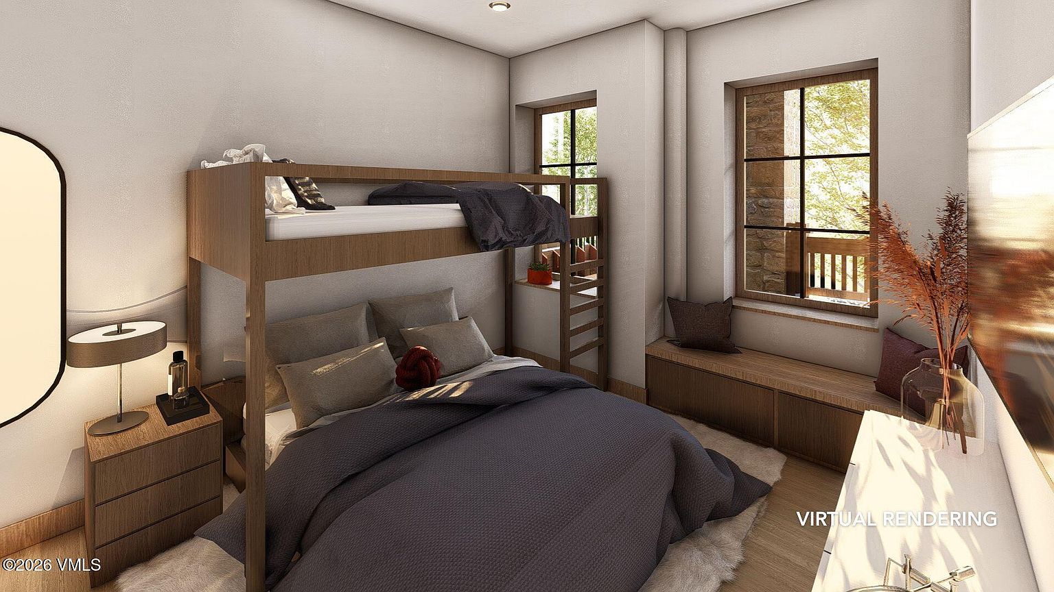 This is a cozy bedroom featuring a wooden bunk bed with a gray comforter on the lower bunk and a dark gray blanket on the upper bunk. The room has two windows with wooden frames, a wooden nightstand with a lamp, and a built-in wooden bench under the windows. The style is rustic and inviting, perfect for a guest room or children's bedroom.