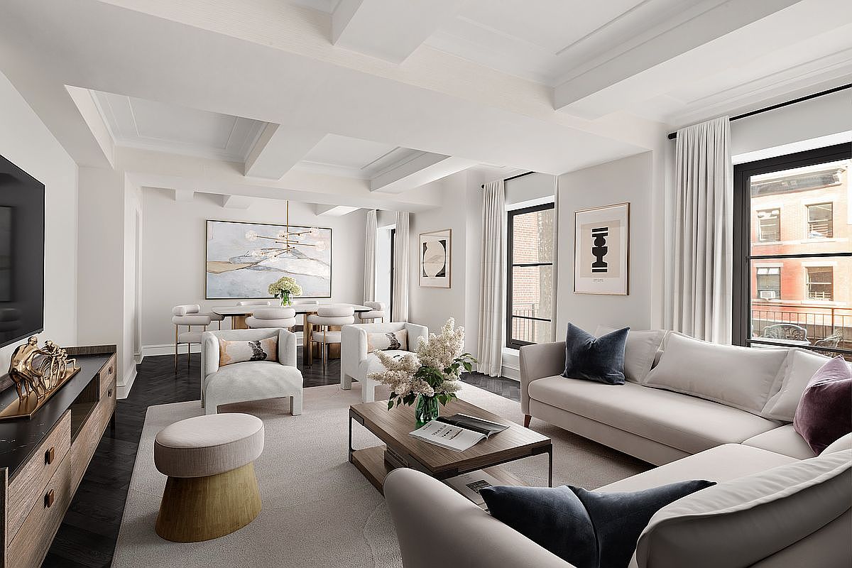 This is a bright and spacious living room with a modern and elegant design. The room features a neutral color palette, comfortable seating arrangements, and large windows that provide ample natural light. The open floor plan seamlessly connects the living area to the dining space, creating an inviting atmosphere perfect for entertaining.