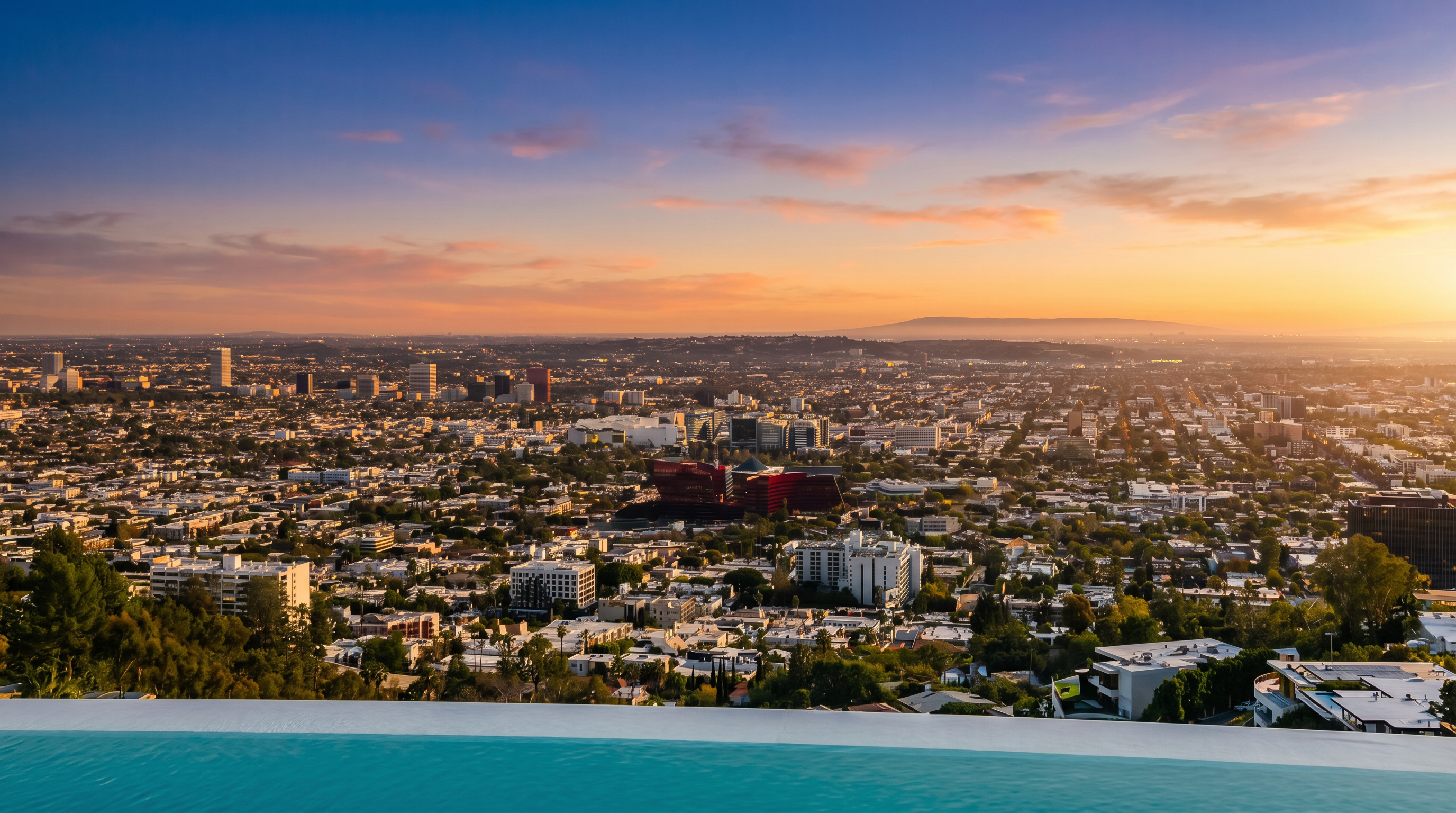 This image captures a breathtaking, high-angle perspective from the edge of an infinity pool, overlooking a sprawling urban landscape under a bright, clear blue sky. The foreground features the vibrant turquoise water of the pool, which seamlessly blends into the horizon, while the background showcases a dense cityscape with prominent buildings and distant hills. The composition emphasizes a luxurious, elevated lifestyle with an expansive, panoramic view of the city.