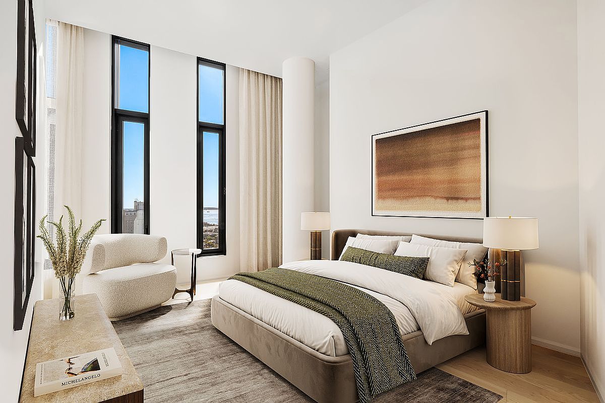 This sophisticated primary bedroom features a neutral color palette with warm earth tones, highlighted by a plush upholstered bed and a textured area rug. Floor-to-ceiling windows allow for abundant natural light, framing a view of the city skyline, while a minimalist armchair and sleek bedside tables complete the modern, high-end aesthetic. The room exudes a serene and luxurious atmosphere, perfect for a contemporary urban residence.