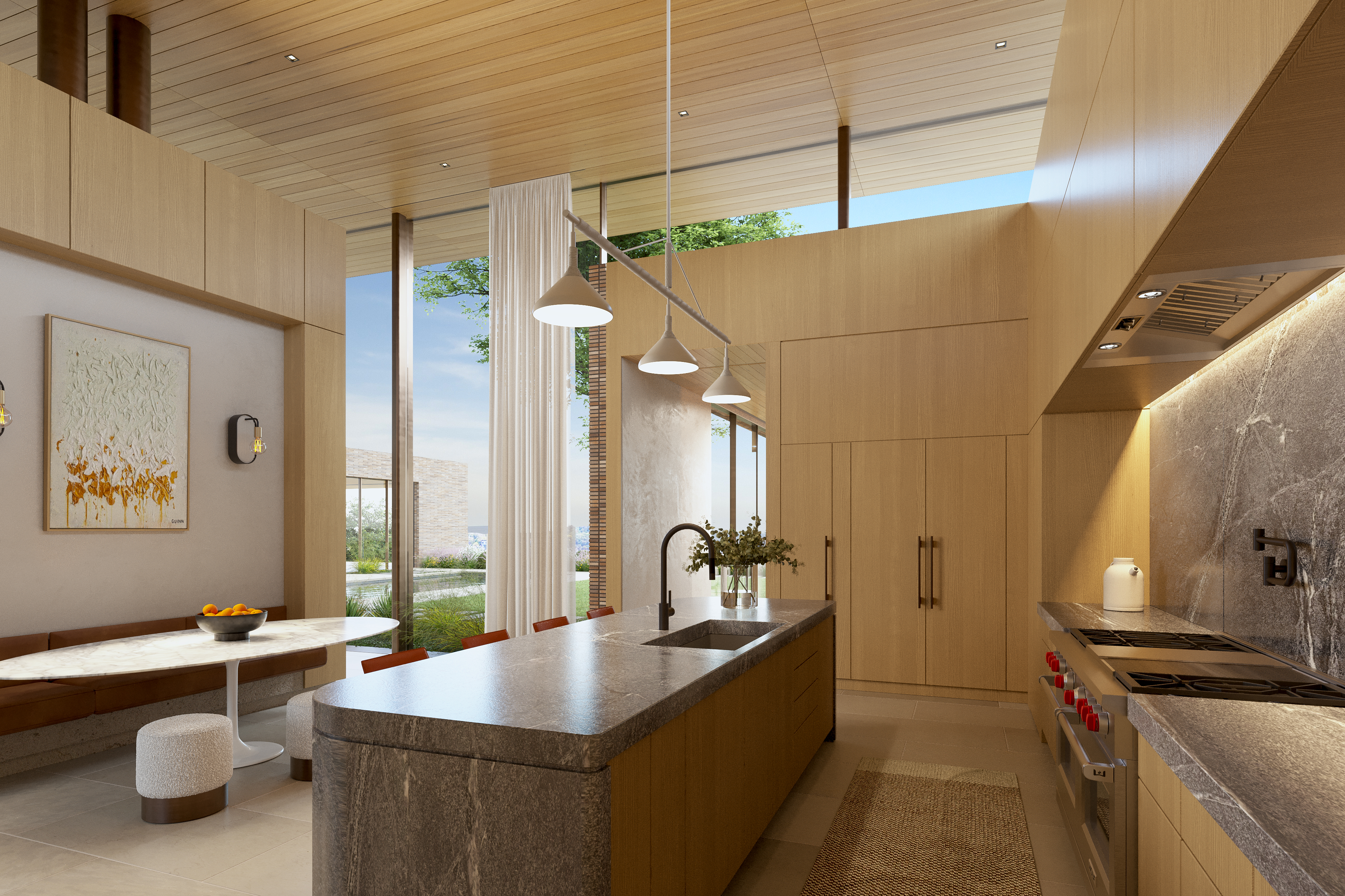 This stunning contemporary kitchen features warm wood cabinetry, a large stone-topped island with an integrated sink, and modern pendant lighting. The space blends seamlessly into an adjacent dining area, with floor-to-ceiling windows that provide natural light and expansive views of the outdoor landscape. The clean, minimalist aesthetic is complemented by high-end finishes and professional-grade appliances, creating a sophisticated and inviting environment.