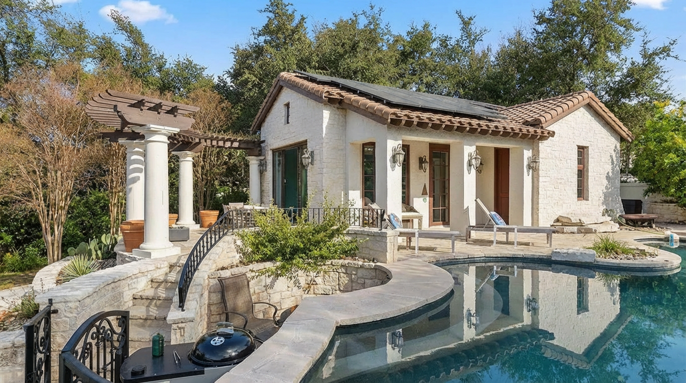 This image showcases a luxury home's pool and spa area. A winding pool with clear water reflects the architecture of the property. Outdoor seating is arranged around the pool, suggesting an upscale and relaxing atmosphere for potential buyers.