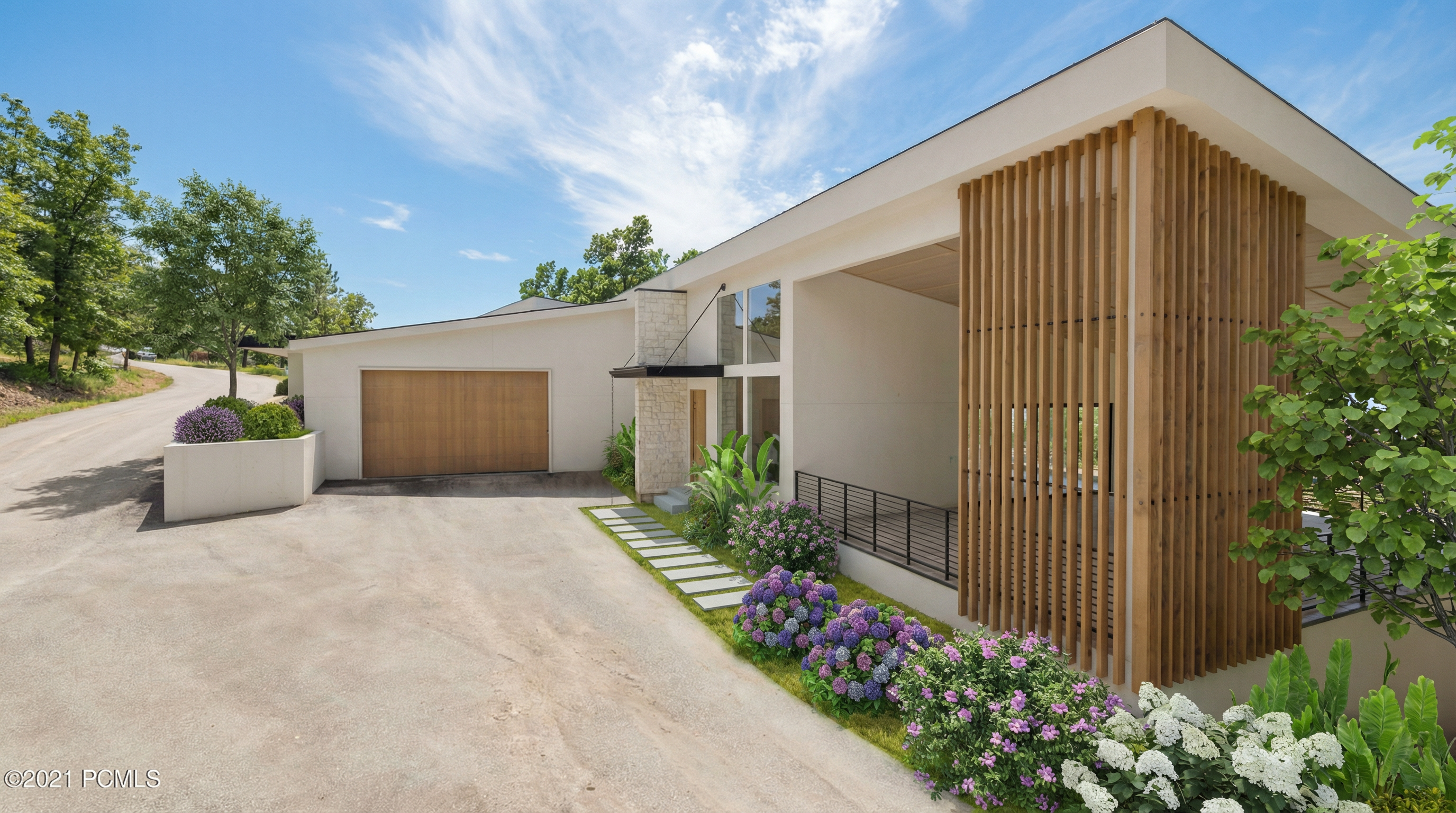 The image showcases the front exterior of a contemporary home, highlighting its clean lines, modern design, and manicured landscaping. A wooden slat privacy screen accents a portion of the facade, while a stone accent wall adds texture and visual interest. The property includes a garage and a well-maintained driveway, suggesting a move-in-ready condition.