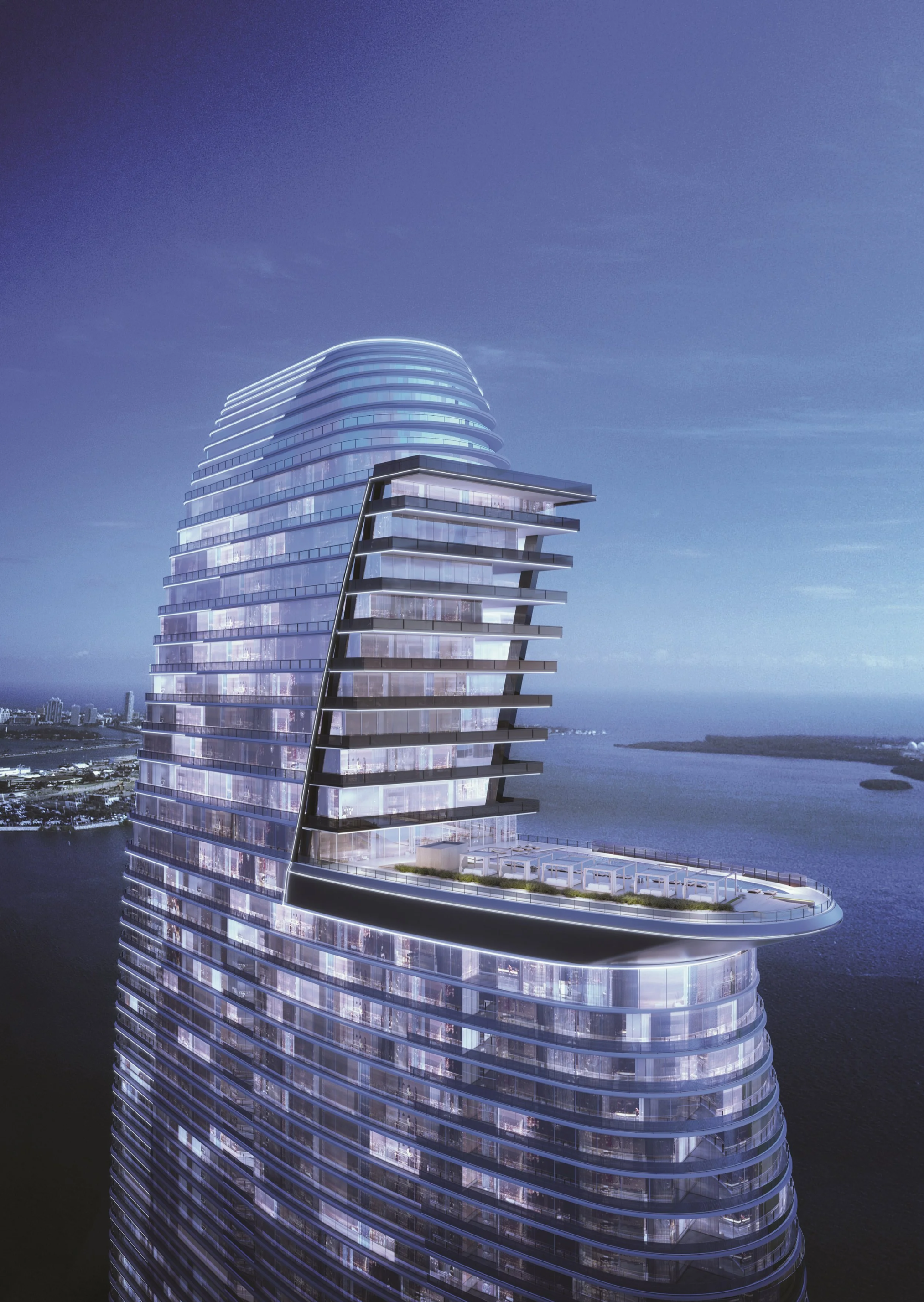 This is an aerial view of a modern luxury high-rise condominium or apartment building. It features curved architectural lines, glass balconies, and an expansive rooftop deck complete with lounge areas. The building overlooks the ocean, adding to its appeal as a high-end residential property.