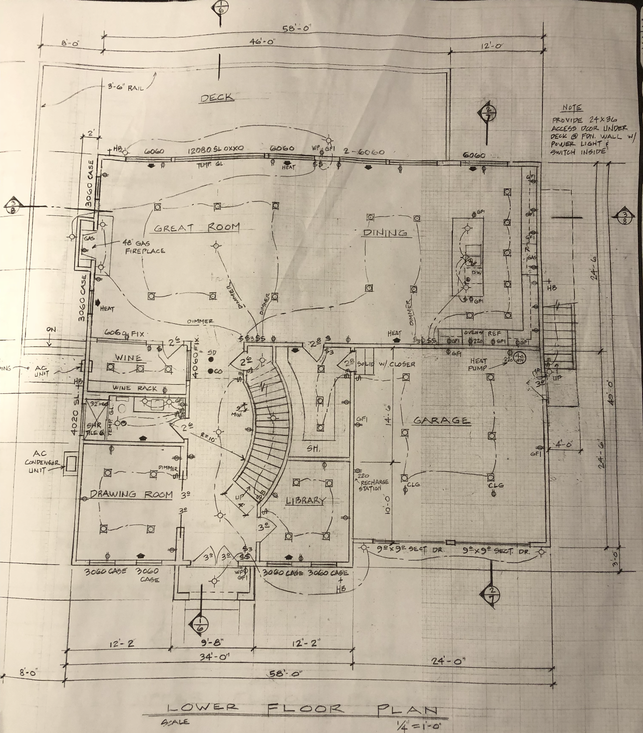 This image displays a detailed architectural lower floor plan for a residential property, drawn on graph paper. The layout includes a great room, dining area, wine room, drawing room, library, garage, and staircase, complete with electrical and structural notations. It is a highly technical document providing a comprehensive overview of the spatial planning and design features of the home level.