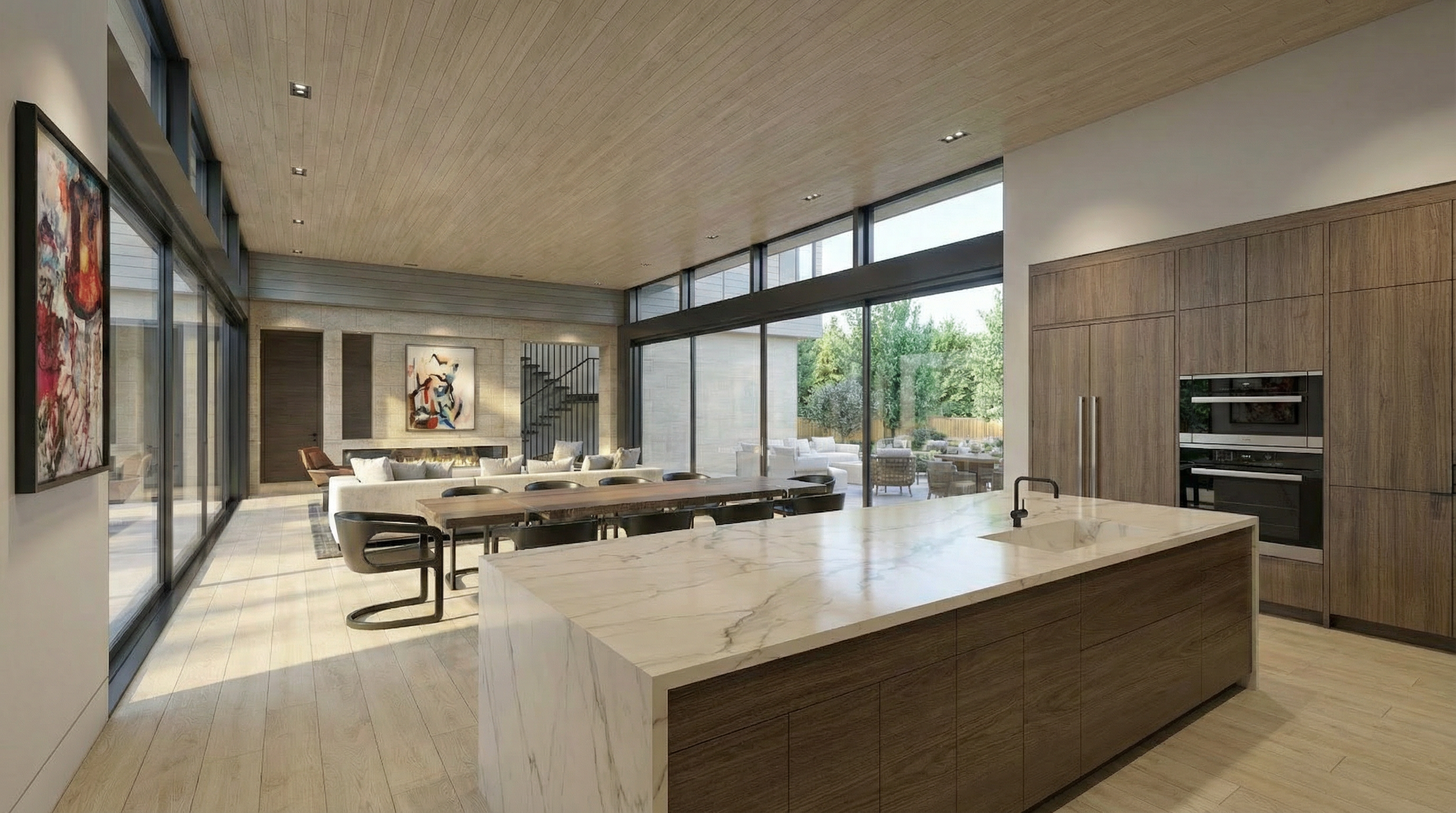 This sleek, modern open-concept space seamlessly blends a high-end kitchen with a dining area and living room. The kitchen features a large waterfall-edge marble island, warm wood cabinetry, and integrated appliances, all set beneath a beautiful wood-paneled ceiling. Expansive floor-to-ceiling glass walls provide abundant natural light and flow through to an inviting outdoor living space, creating an airy, sophisticated atmosphere.