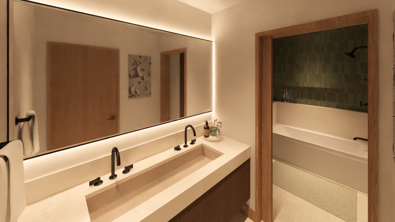 The image showcases a primary bathroom featuring a modern vanity with dual sinks, sleek black fixtures, and a spacious mirror with integrated lighting. In the background, a framed doorway leads to a bathtub and shower area tiled in green. The bathroom exudes a clean, minimalist aesthetic and offers a spa-like ambiance.
