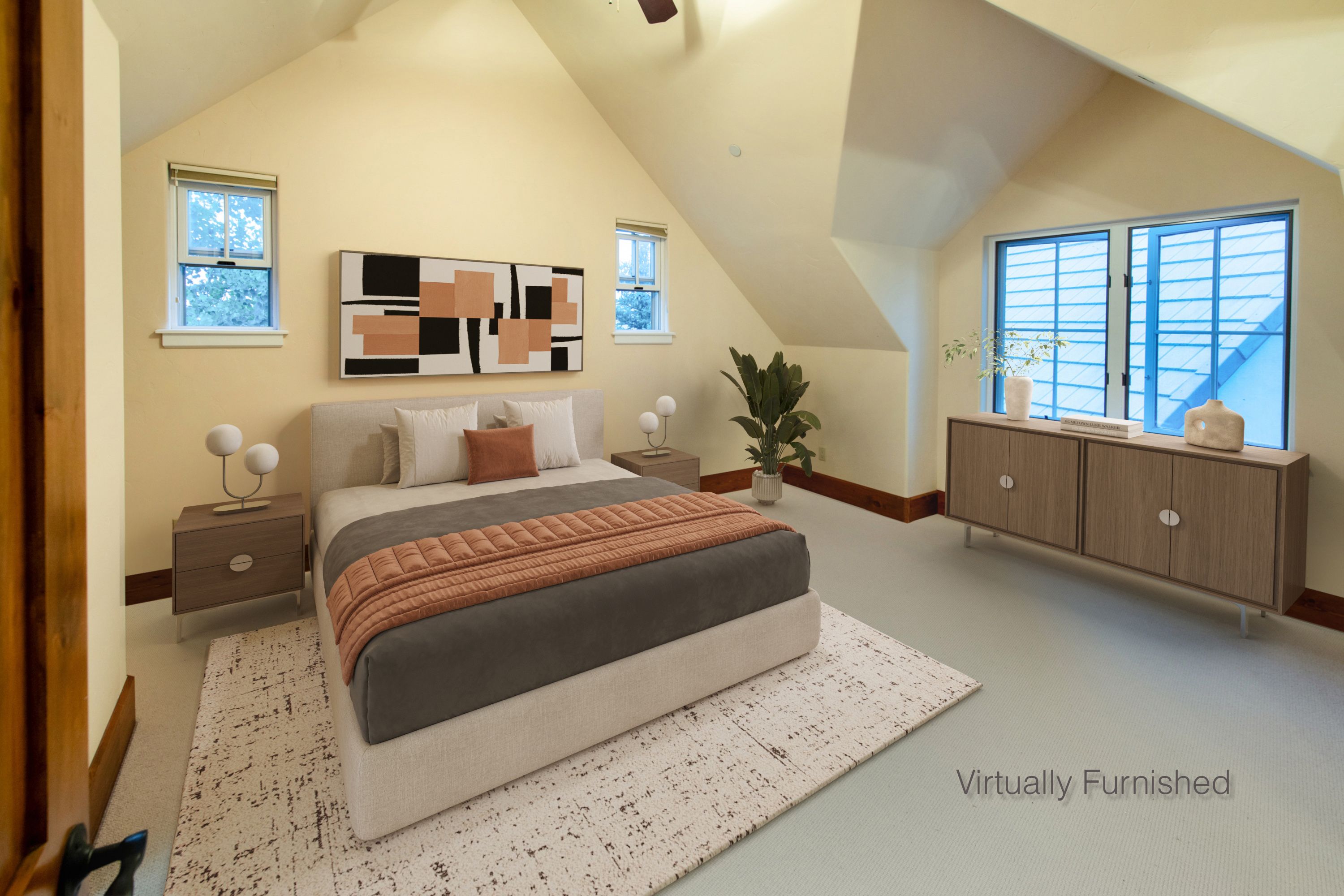 This spacious primary bedroom features a vaulted ceiling and a neutral color palette, creating an airy and inviting atmosphere. The room is furnished with a modern bed, matching nightstands, and a sleek wooden dresser, all complemented by a textured area rug and contemporary wall art. Large windows allow for ample natural light, highlighting the clean lines and sophisticated, minimalist design of the space.