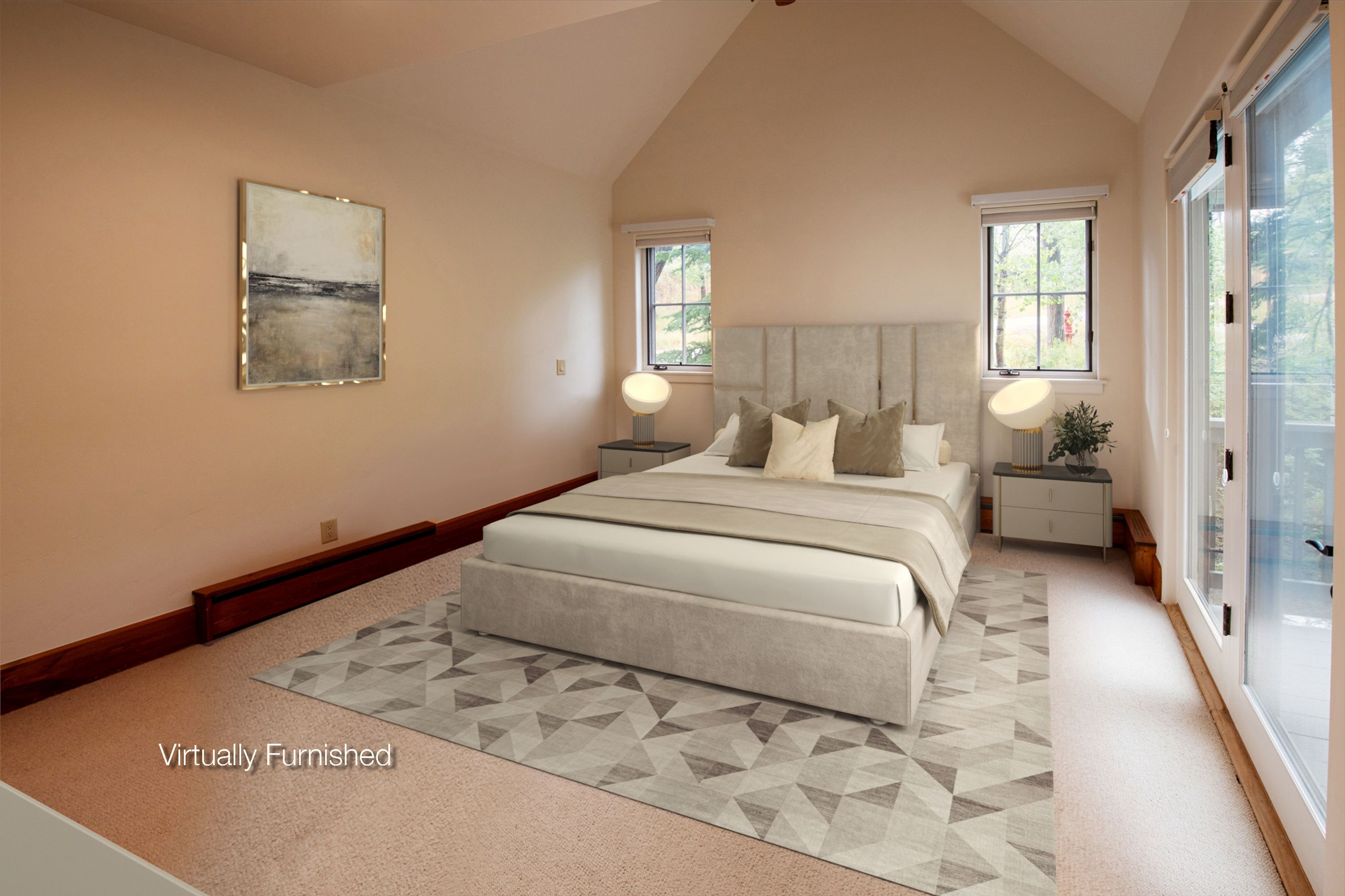 This primary bedroom features a vaulted ceiling and a neutral, calming color palette, creating an airy and spacious atmosphere. The room is anchored by a plush, upholstered bed centered between two modern nightstands with contemporary lamps, all set atop a geometric-patterned area rug. Large glass sliding doors provide ample natural light and direct access to an outdoor balcony, enhancing the room's serene and inviting appeal.