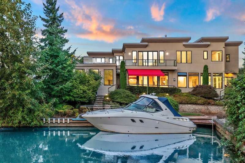 Grand Waterfront Estate with Private Canal Moorage in Newport Shores